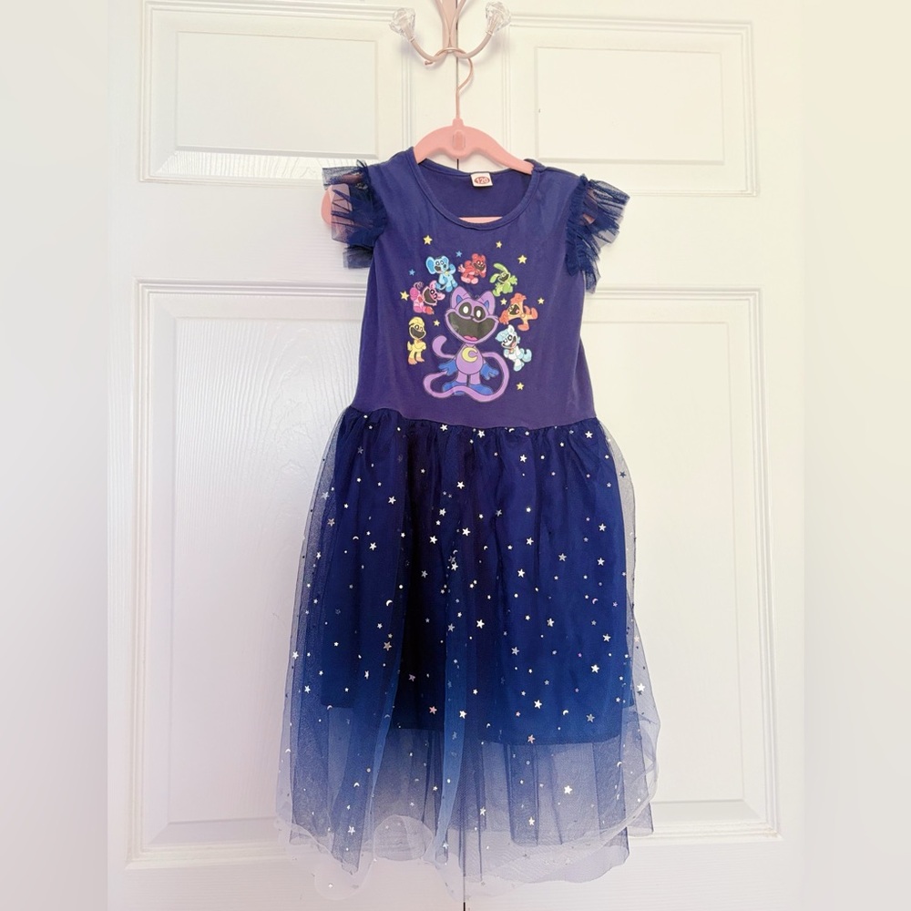 SMILING CRITTERS | Blue Tulle Dress with Star Accents.